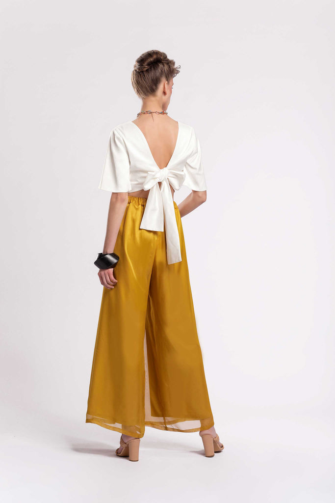  Wide leg trousers Front pleats Elastic waist from the back Concealed zipper fastening Fully lined Fabric: Satin Chiffon jujule lemonie yellow